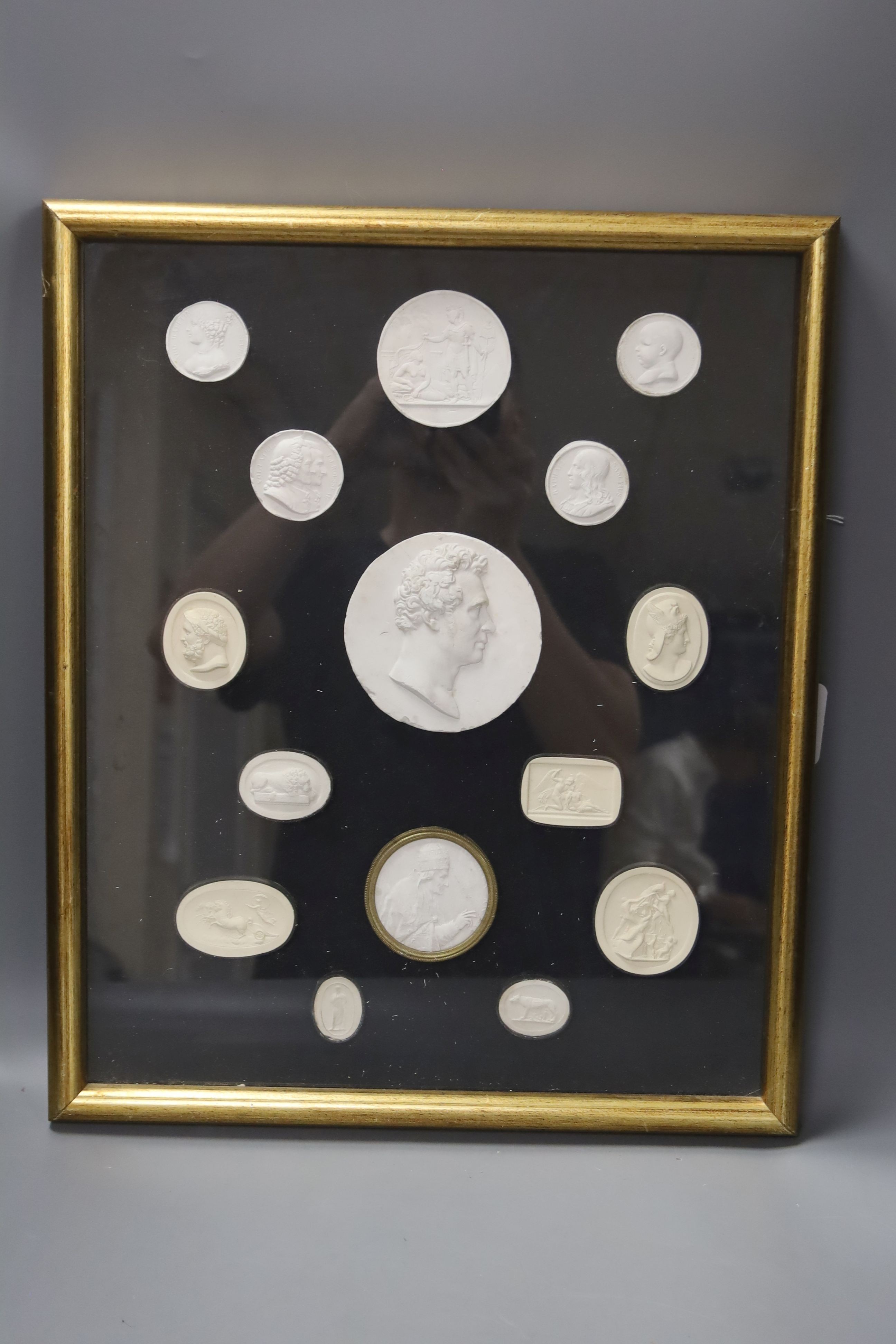 A framed set of Grand Tour gems, 19th century and reproductions